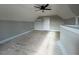 Spacious bonus room with bright natural light, perfect for recreation or hobbies at 541 Delma Grimes Rd, Coats, NC 27521