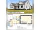 Charming two-story home featuring a classic design, large windows, and beautiful landscaping at 541 Delma Grimes Rd, Coats, NC 27521