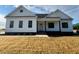 Beautifully landscaped modern farmhouse-style home with a well kept front yard at 541 Delma Grimes Rd, Coats, NC 27521