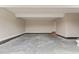 Spacious garage with concrete floors, brick steps, and ample room for storage at 541 Delma Grimes Rd, Coats, NC 27521
