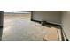 Open garage features bare floors ready to be customized to your liking at 541 Delma Grimes Rd, Coats, NC 27521
