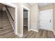 Hallway with hard wood floors, staircase, doors, and trim at 541 Delma Grimes Rd, Coats, NC 27521