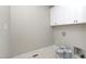 Laundry room with washer and dryer hookups and storage cabinets at 541 Delma Grimes Rd, Coats, NC 27521