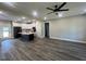 Open concept kitchen and living room with tile floors and modern ceiling fan at 541 Delma Grimes Rd, Coats, NC 27521