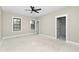 Bright main bedroom with natural light, walk-in closet, and neutral paint at 541 Delma Grimes Rd, Coats, NC 27521