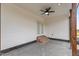 Covered patio with ceiling fan, brick steps, and a view of the surrounding landscape at 541 Delma Grimes Rd, Coats, NC 27521