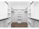A well-organized walk-in closet with shelves and hanging rods providing ample storage space at 541 Delma Grimes Rd, Coats, NC 27521