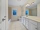 Clean bathroom, double vanity, and a bathtub at 5621 Voorhees Ln, Holly Springs, NC 27540