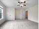 Bedroom with double door closets and ceiling fan at 5621 Voorhees Ln, Holly Springs, NC 27540