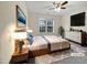 Spacious bedroom with large window and ceiling fan at 5621 Voorhees Ln, Holly Springs, NC 27540