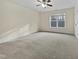 Bright bedroom with carpeted floor and ceiling fan at 5621 Voorhees Ln, Holly Springs, NC 27540