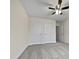 Bedroom with double door closets and ceiling fan at 5621 Voorhees Ln, Holly Springs, NC 27540