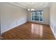 Bright dining room with hardwood floors and chandelier at 5621 Voorhees Ln, Holly Springs, NC 27540
