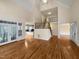 Two story living room with hardwood floors and open floor plan at 5621 Voorhees Ln, Holly Springs, NC 27540