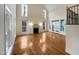 Large living room featuring hardwood floors and fireplace at 5621 Voorhees Ln, Holly Springs, NC 27540