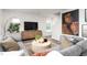 Cozy living room with sectional sofa and a large statement art piece at 6012 Sodium St, Raleigh, NC 27610
