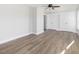 Bright bedroom featuring hardwood floors, a ceiling fan, and double closets at 624 S Eighth St, Mebane, NC 27302