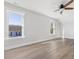 Bedroom with hardwood floors, a ceiling fan, and large windows for natural light at 624 S Eighth St, Mebane, NC 27302