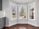 Bright breakfast nook featuring three large windows and beautiful hardwood flooring at 624 S Eighth St, Mebane, NC 27302