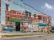 Colorful mural depicting a historic street scene on the side of a brick building at 624 S Eighth St, Mebane, NC 27302