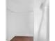Walk-in closet with hardwood floors and white shelving at 624 S Eighth St, Mebane, NC 27302