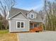 Charming gray two story home featuring a welcoming front porch at 624 S Eighth St, Mebane, NC 27302