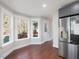 Bright kitchen with stainless steel refrigerator and sunlit view at 624 S Eighth St, Mebane, NC 27302