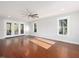 Bright, spacious living room with hardwood floors, modern ceiling fan, and lots of natural light at 624 S Eighth St, Mebane, NC 27302