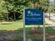 Sign for Holt Street Park, surrounded by lush greenery and a peaceful setting at 624 S Eighth St, Mebane, NC 27302