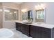Bathroom with double vanity, marble flooring, and a walk-in shower at 63 Rice Rd # 01, Zebulon, NC 27597