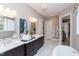 Luxurious bathroom with double vanity, marble floors, and a free-standing tub at 63 Rice Rd # 01, Zebulon, NC 27597