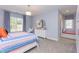 Charming bedroom with a window seat and colorful bedding at 63 Rice Rd # 01, Zebulon, NC 27597