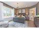 Spacious bedroom with a plush bed, large windows, and an ensuite bathroom at 63 Rice Rd # 01, Zebulon, NC 27597