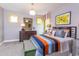 Bedroom with striped comforter and built-in bench at 63 Rice Rd # 01, Zebulon, NC 27597