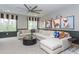 Spacious bonus room with sectional sofa and dog-themed artwork at 63 Rice Rd # 01, Zebulon, NC 27597