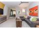 Bonus room with L-shaped sofa, large art, and built-in cabinet at 63 Rice Rd # 01, Zebulon, NC 27597