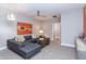 Gray sectional sofa and colorful artwork in bonus room at 63 Rice Rd # 01, Zebulon, NC 27597