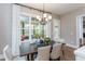 Charming breakfast nook with a wooden table and neutral chairs, near sliding glass doors at 63 Rice Rd # 01, Zebulon, NC 27597