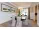 Formal dining room with a wood table, neutral chairs, and wainscoting at 63 Rice Rd # 01, Zebulon, NC 27597