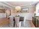 Formal dining room with a wood table, neutral chairs, and wainscoting at 63 Rice Rd # 01, Zebulon, NC 27597