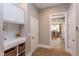 Drop zone with built-in shelving and view to dining room at 63 Rice Rd # 01, Zebulon, NC 27597