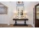 Elegant entryway, console table, butterfly wallpaper, hardwood floors at 63 Rice Rd # 01, Zebulon, NC 27597