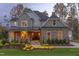 Stunning two-story home with warm lighting, beautifully landscaped at 63 Rice Rd # 01, Zebulon, NC 27597