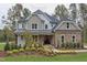 Two-story home with stone and siding, landscaped yard at 63 Rice Rd # 01, Zebulon, NC 27597