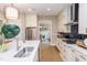 Modern kitchen with white cabinets, stainless steel appliances, and a gas cooktop at 63 Rice Rd # 01, Zebulon, NC 27597