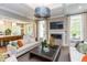 Open concept living room with kitchen views and a cozy fireplace at 63 Rice Rd # 01, Zebulon, NC 27597
