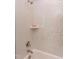 Shower with hexagon tiles and a built-in shelf at 63 Rice Rd # 01, Zebulon, NC 27597