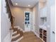 Staircase with wood steps and metal railing leading to upper level at 63 Rice Rd # 01, Zebulon, NC 27597
