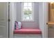 Built-in window seat with a pink cushion, offering a cozy reading nook at 63 Rice Rd # 01, Zebulon, NC 27597