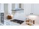 Elegant kitchen with sleek appliances, stylish backsplash, and ample counter space at 664 Morning Glade St, Wake Forest, NC 27587
